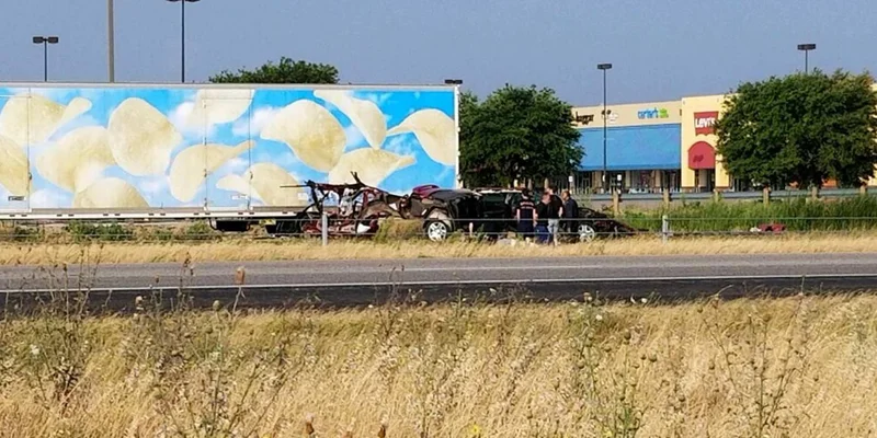 Vehicle cut in half in collision with 18-wheeler