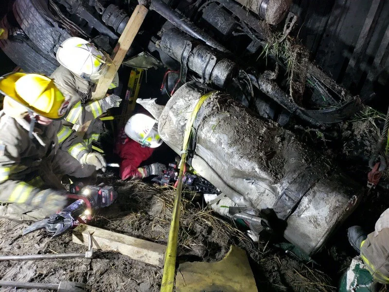 Man entrapped in overturned, partially submerged 18-wheeler airlifted to hospital
