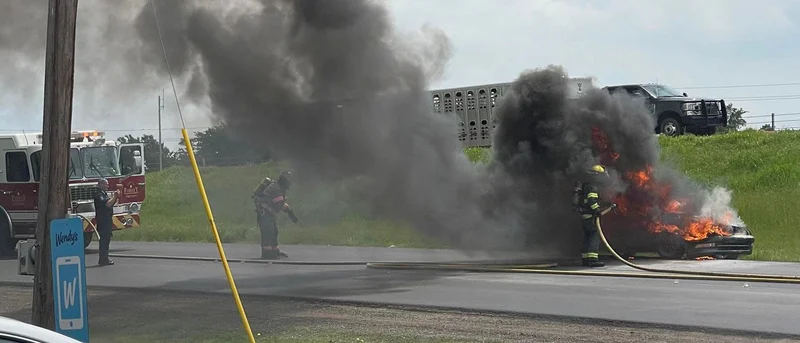 Firefighters extinguish roadside car fire in Forney