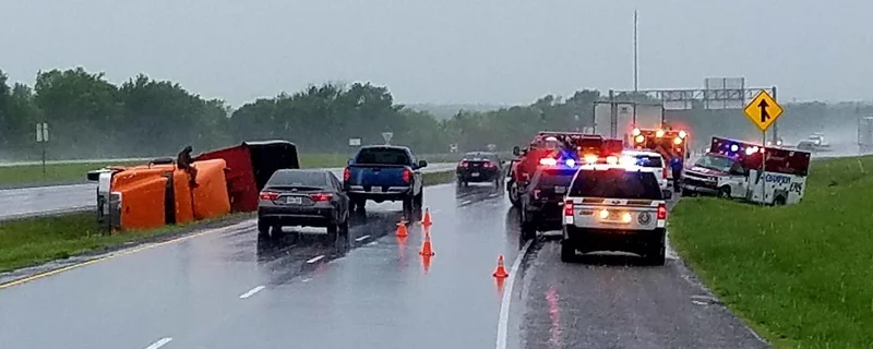 18-wheeler overturns in crash with ambulance on U.S. Highway 80