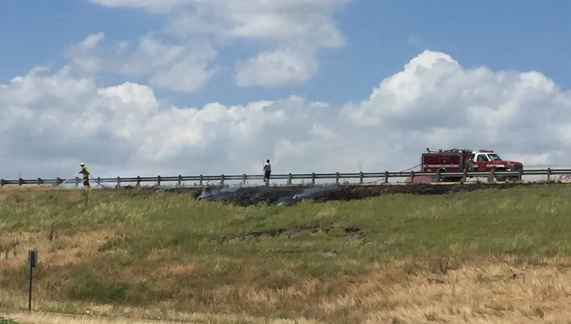 Firefighters extinguish roadside fire along Interstate 20