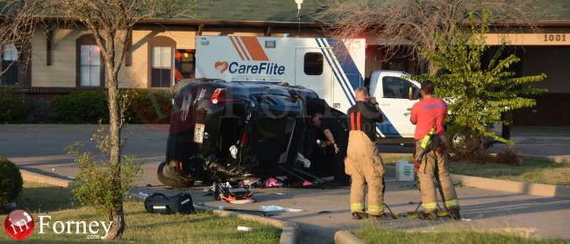 Two injured after vehicle leaves highway, overturns in daycare parking lot