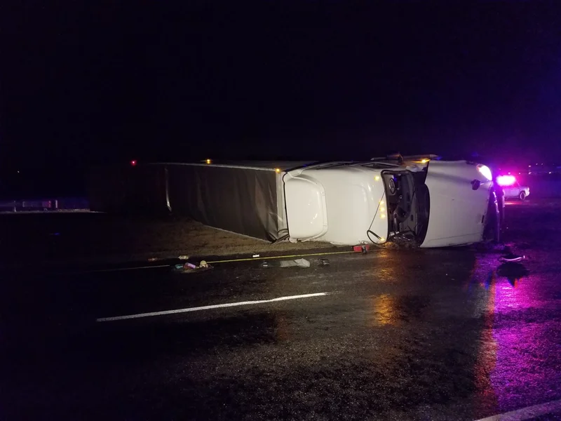 Overturned 18-wheeler forces closure of Spur 557